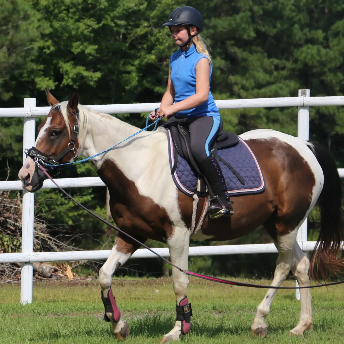 Girl is riding a Haflinger during her Western riding lesson