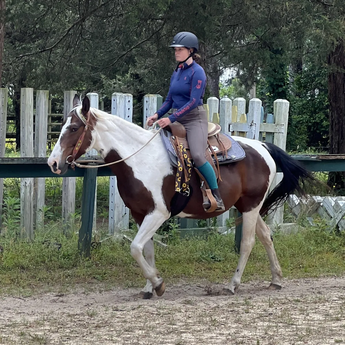 Student is riding back from her lesson 