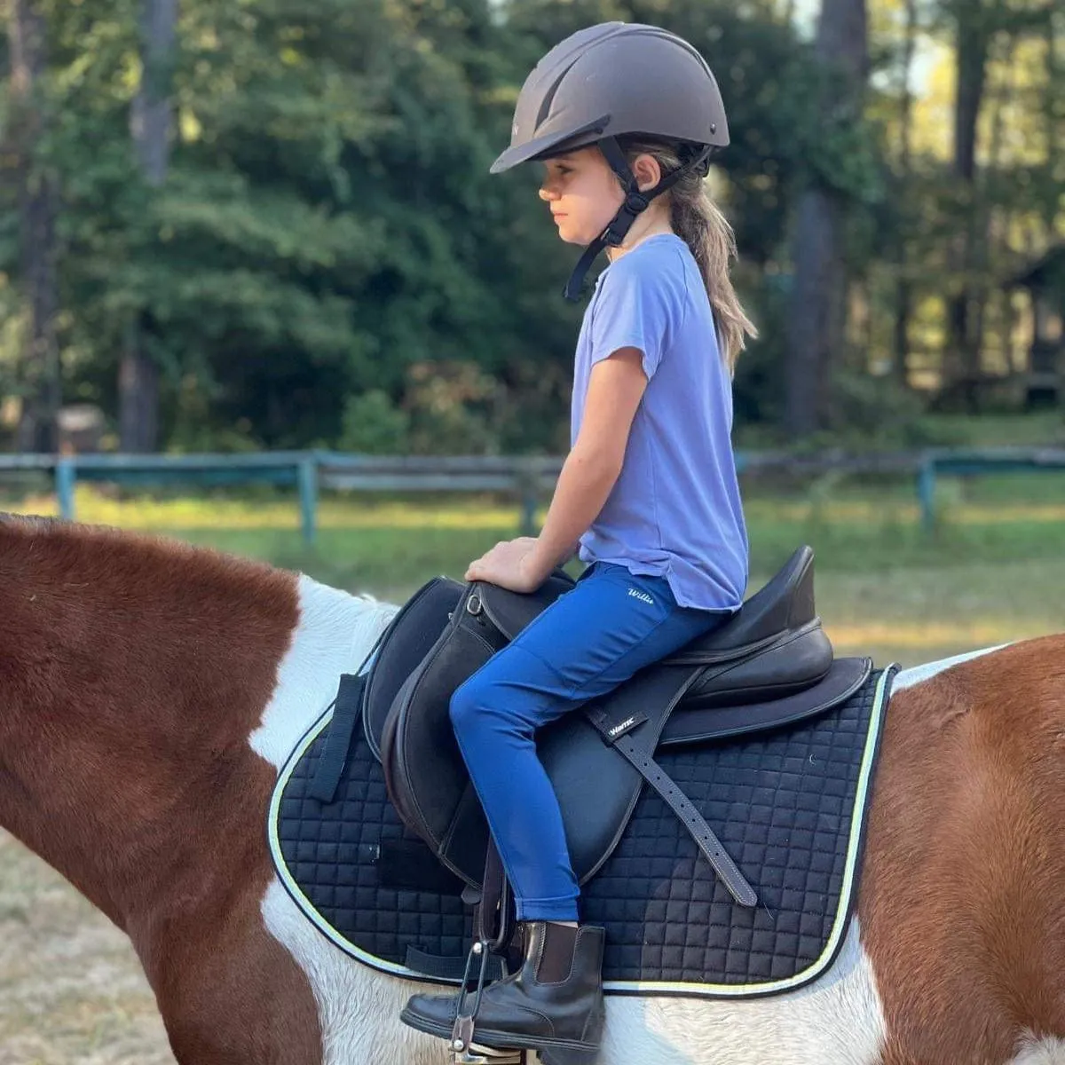 Girl riding in a trot 