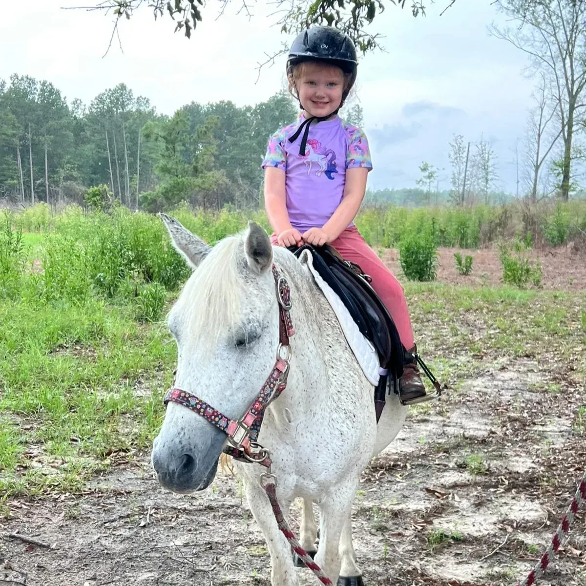 Riding in the rain at camp