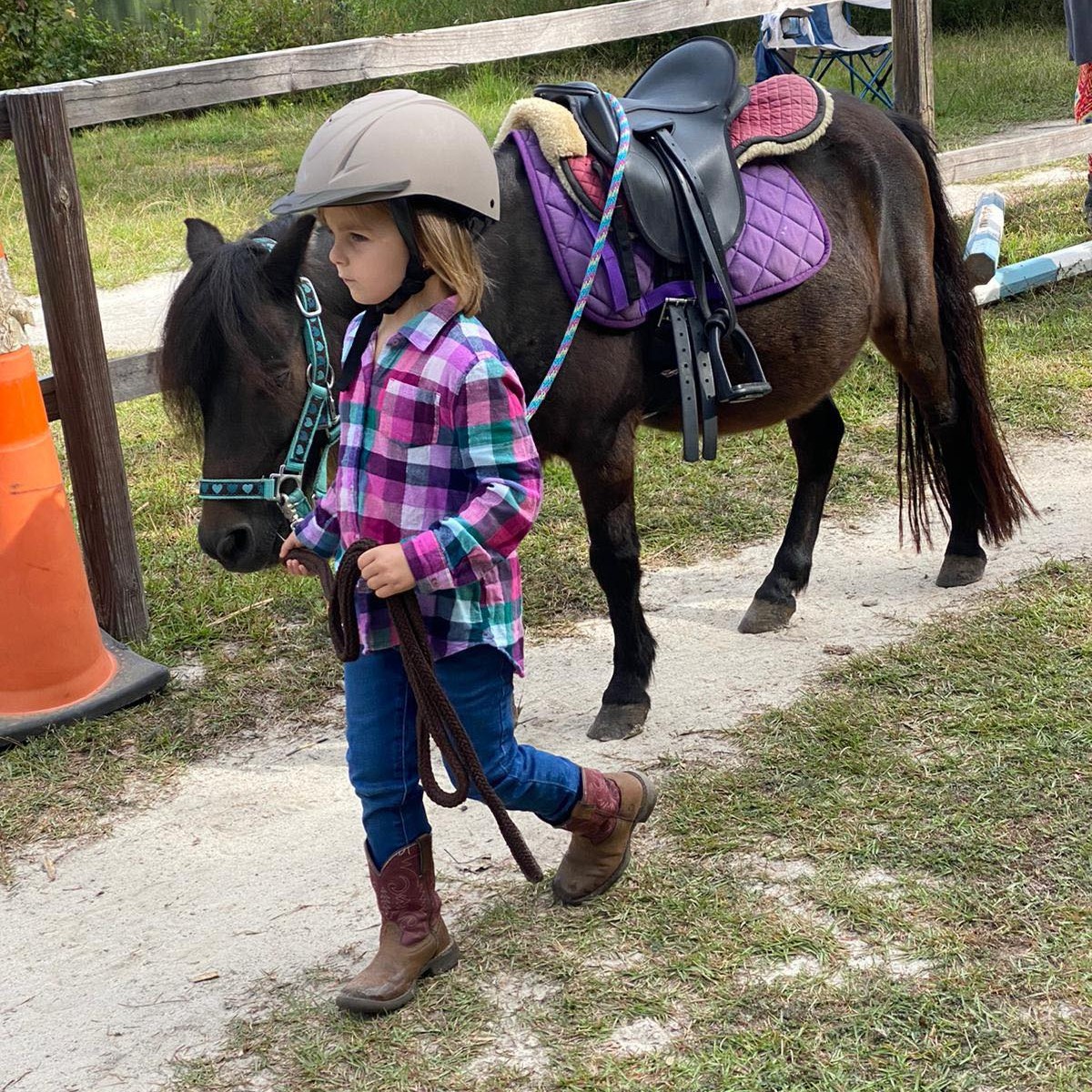 Tiny Tot girl is loving her lessons pony