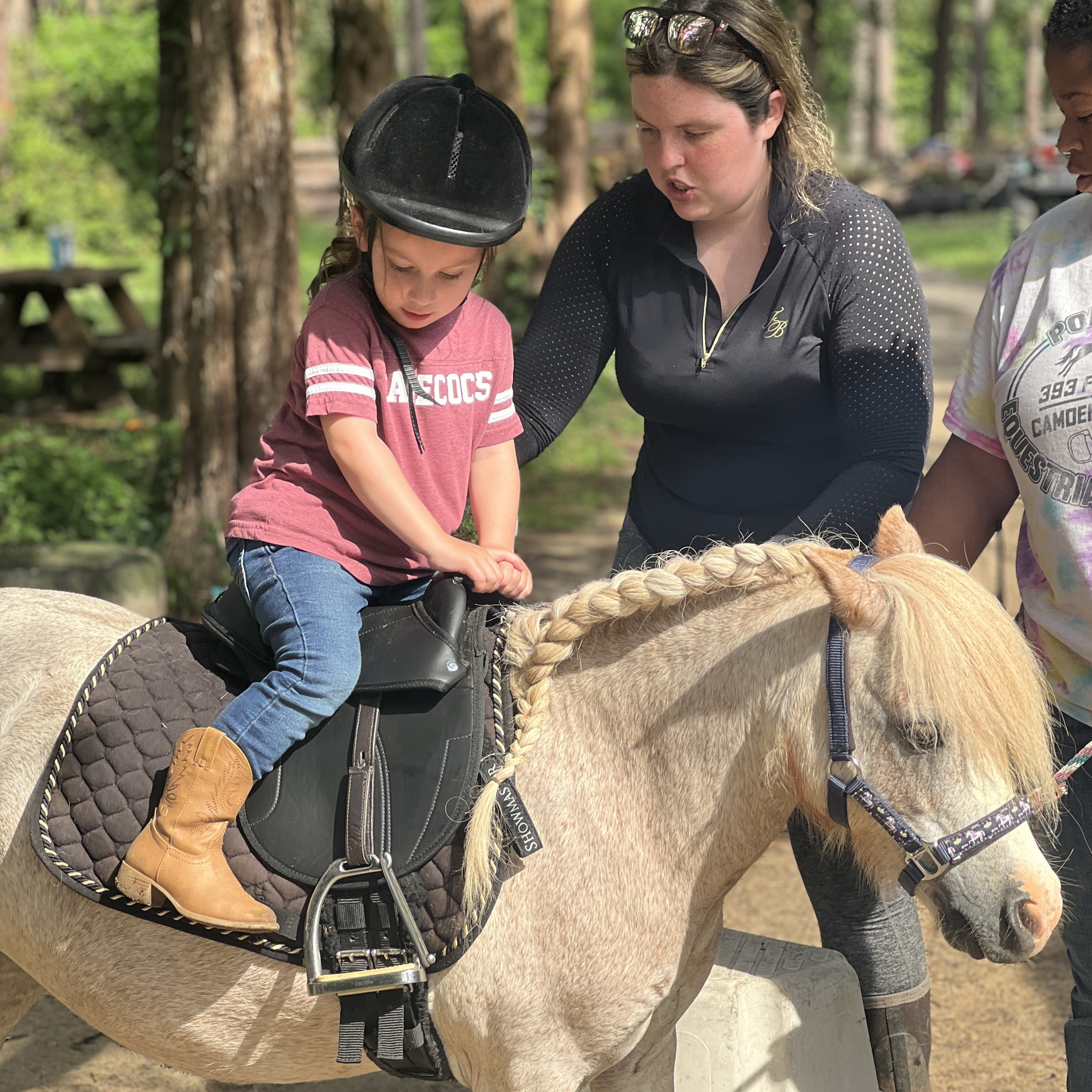 Little girl is loving her lessons pony 
