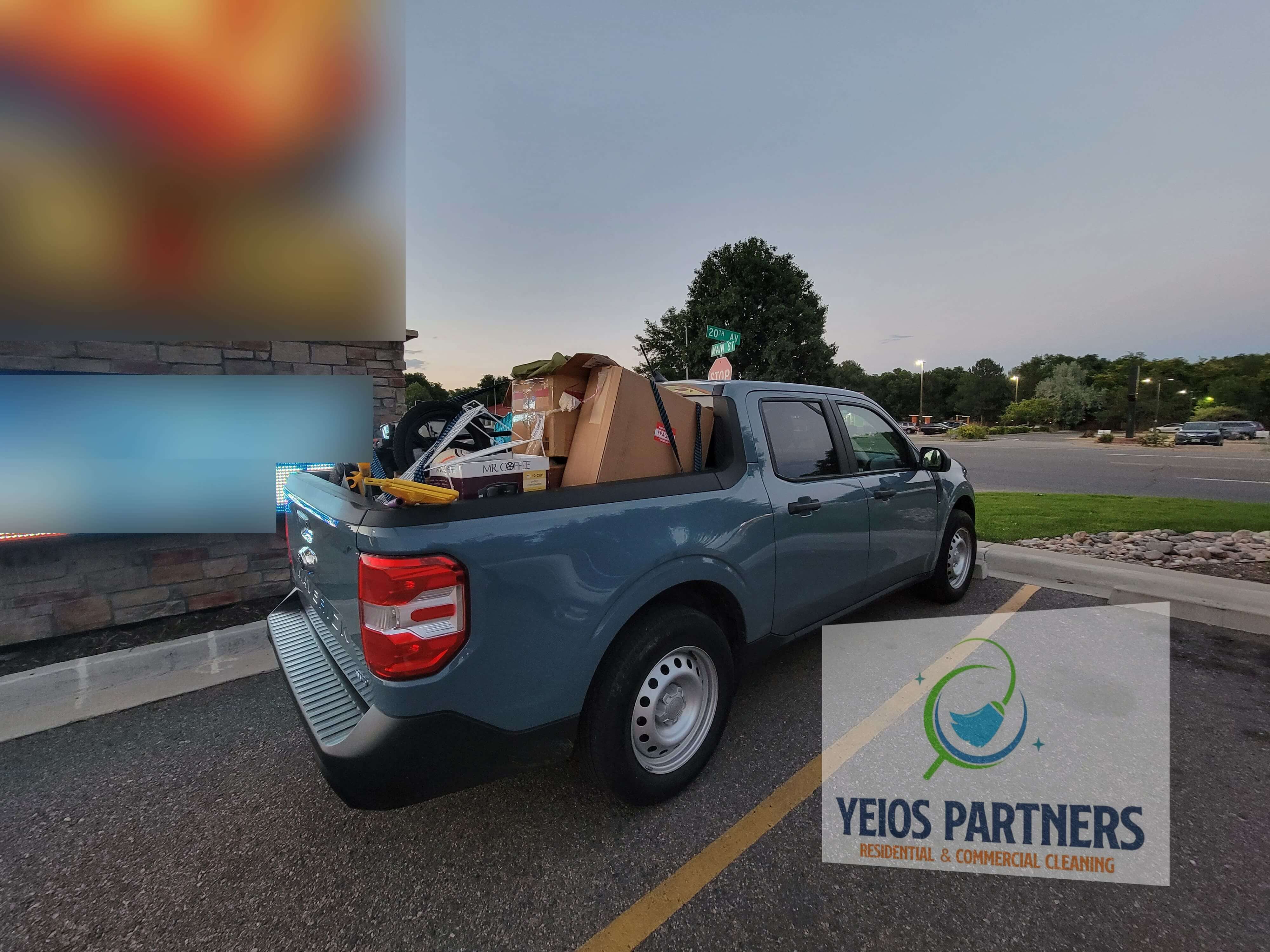 Professional team hauling away old furniture and yard debris in Boulder.