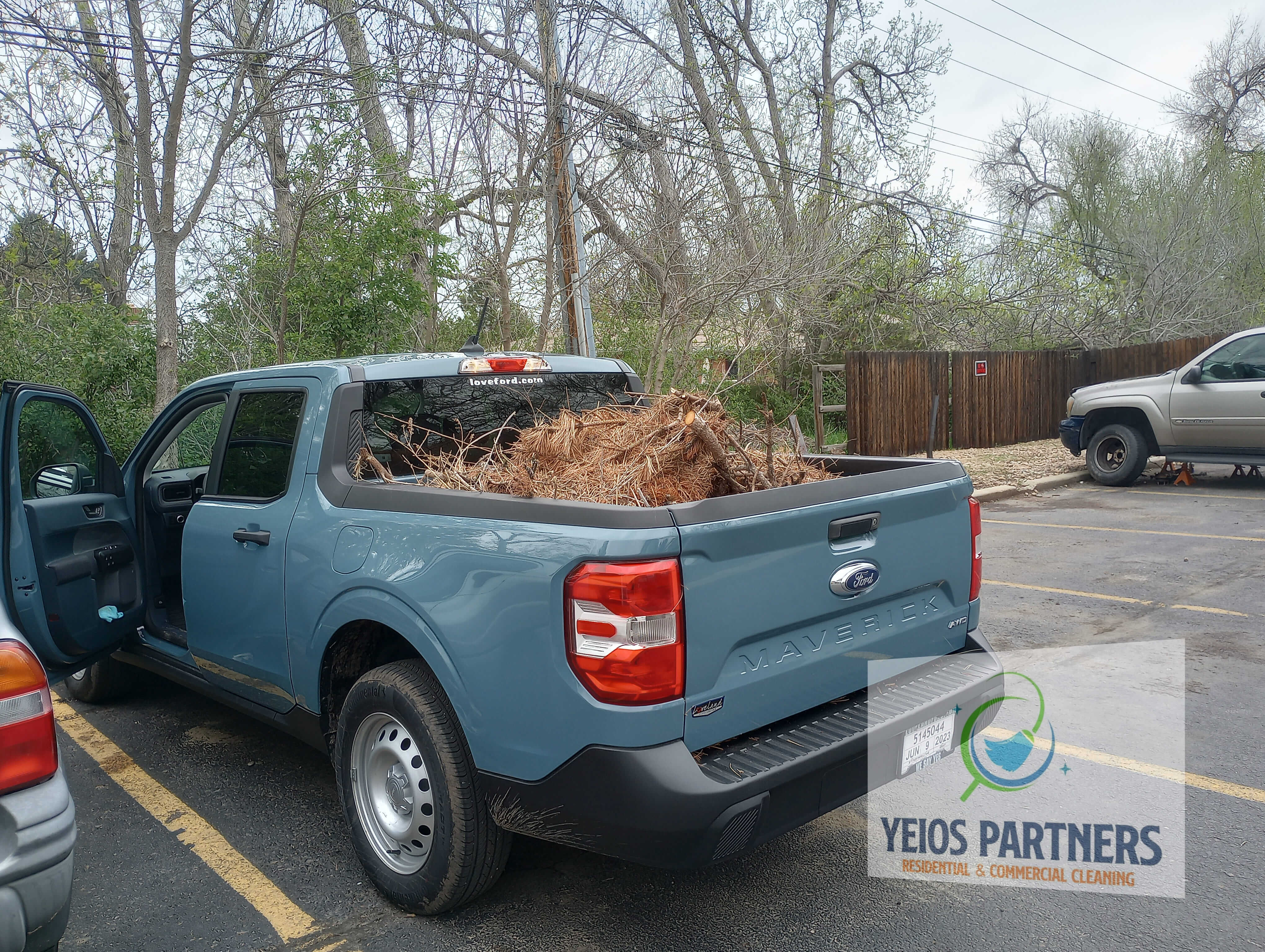Professional team hauling away old furniture and yard debris in longmont