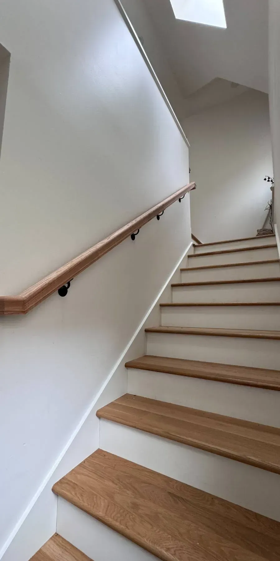 Completed Stair Railing Install by Seattle carpentry and home repair specialists {{custom_values.business_name}