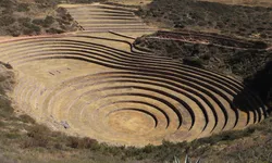 Circular terraced ruins of Moray in Peru surrounded by dry landscape