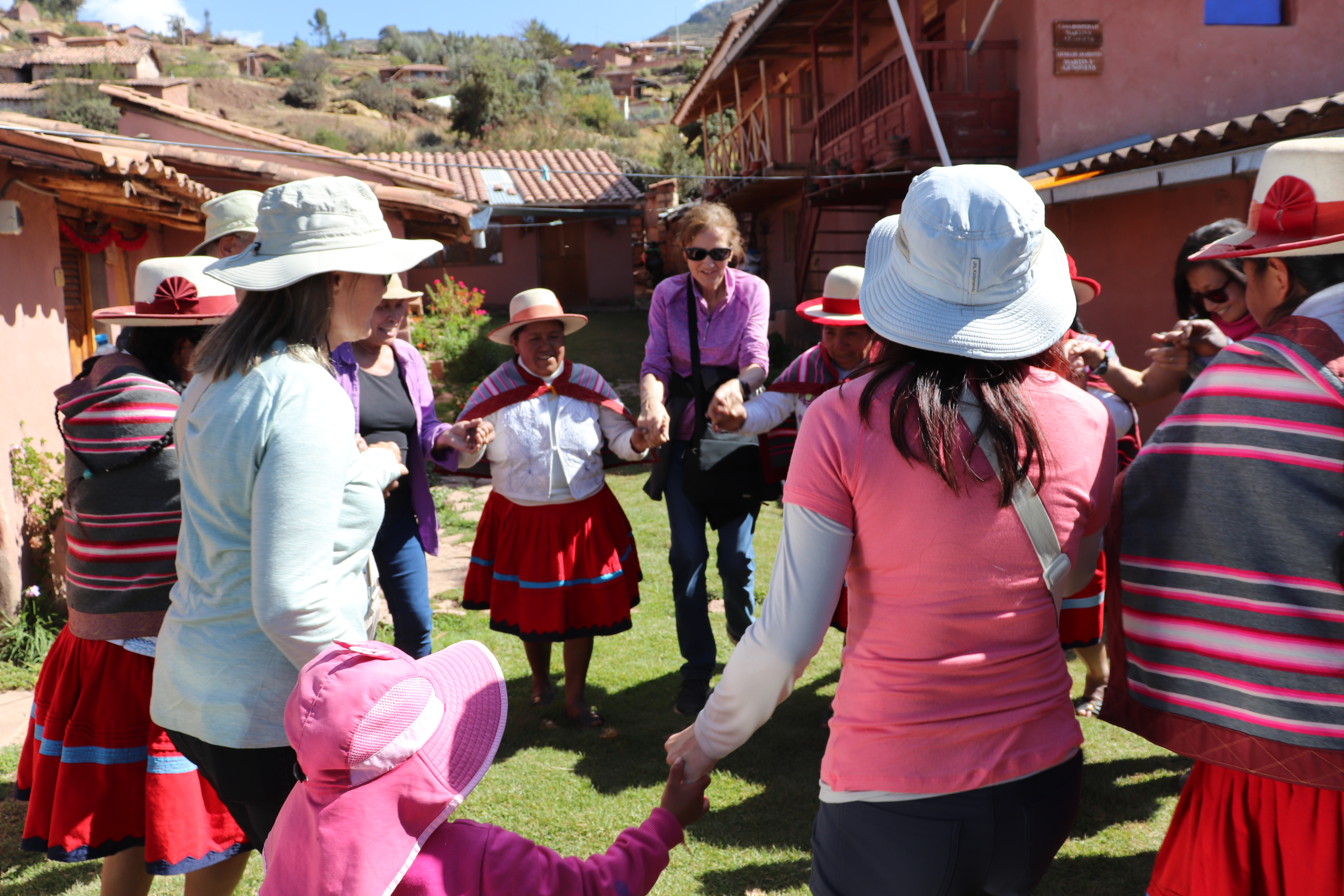 Image of people in a circle dancing