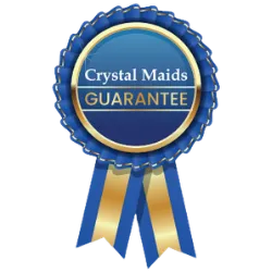 Blue and gold award ribbon seal featuring the text "Crystal Maids GUARANTEE," representing our 100% satisfaction commitment
