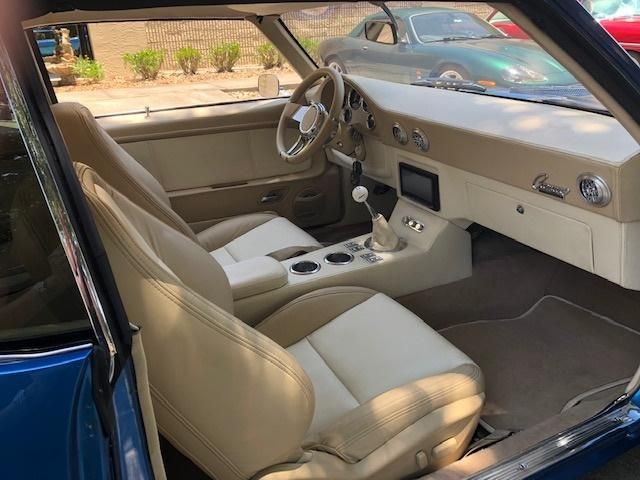 Classic white car interior restored by A&E Auto upholstery in Melbourne Fl