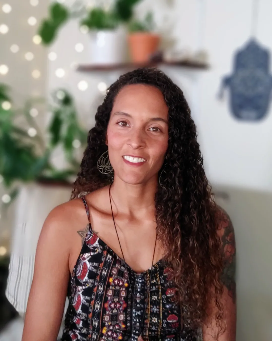 trees on hill under yellow sky at daytime