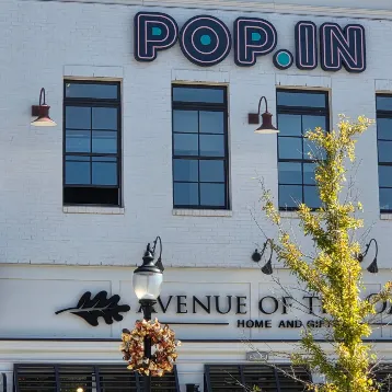 Illuminated channel letter sign on a storefront at the Cumming City Center in Cumming, GA