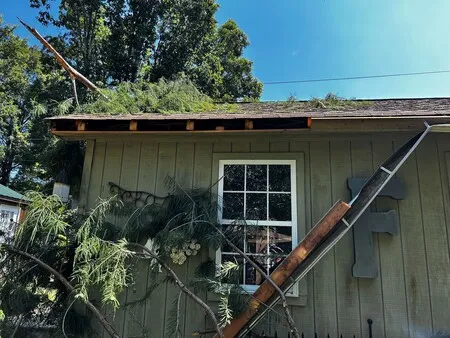 An MBA Roofing professional repairing a roof 