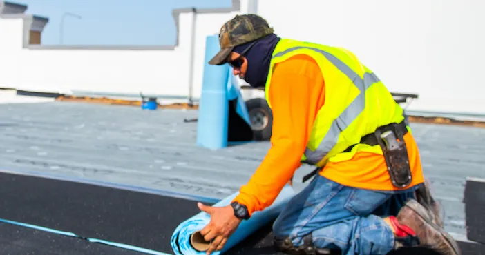 An MBA Roofing professional repairing a roof 