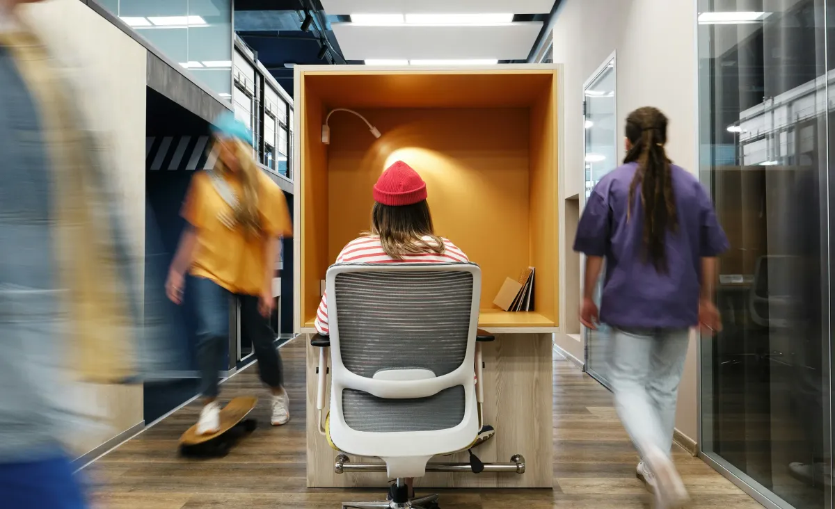 Intro Picture of a woman in red beanie in a flow state of working