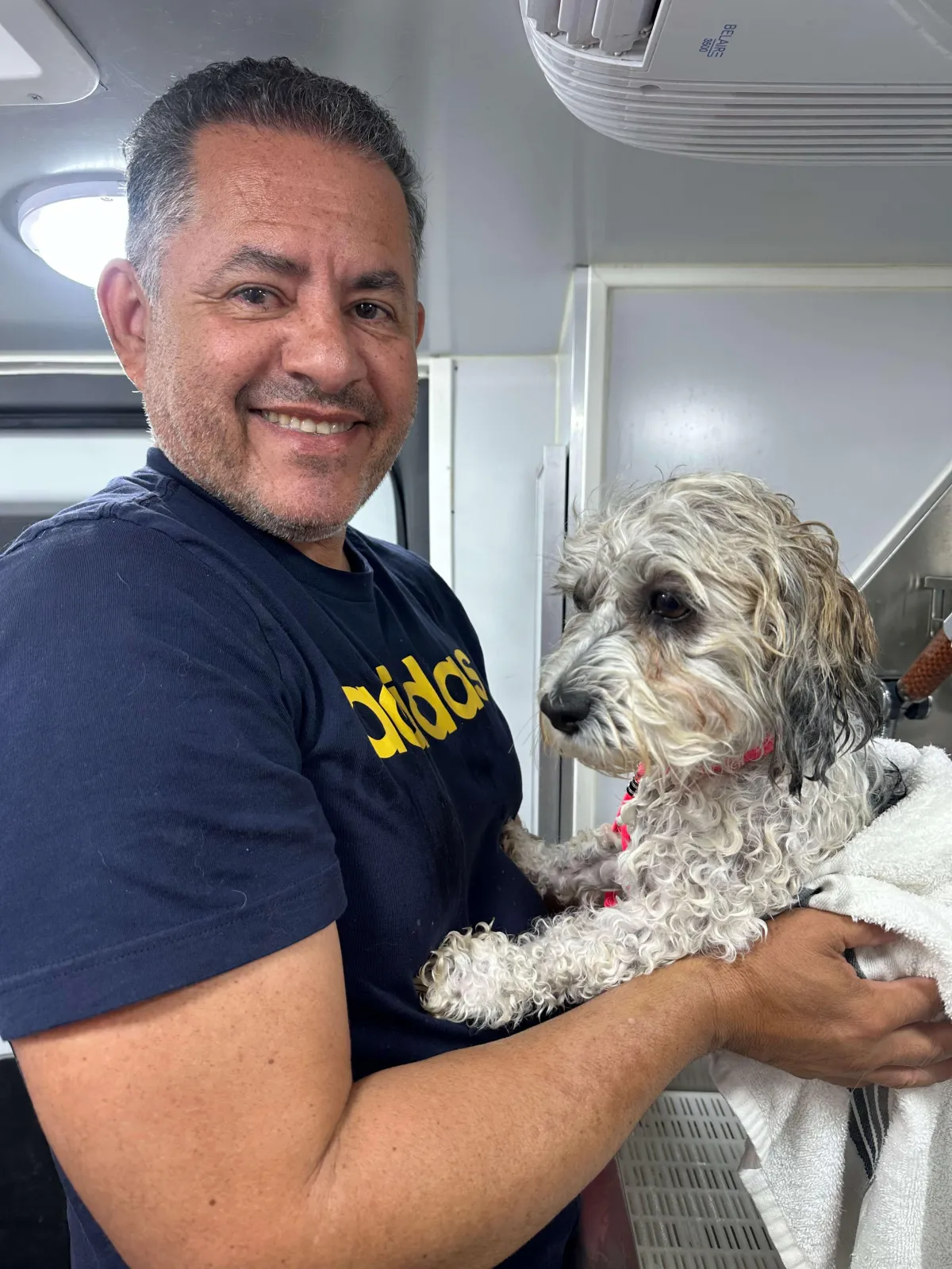 man in blue suit jacket standing beside woman in black coat