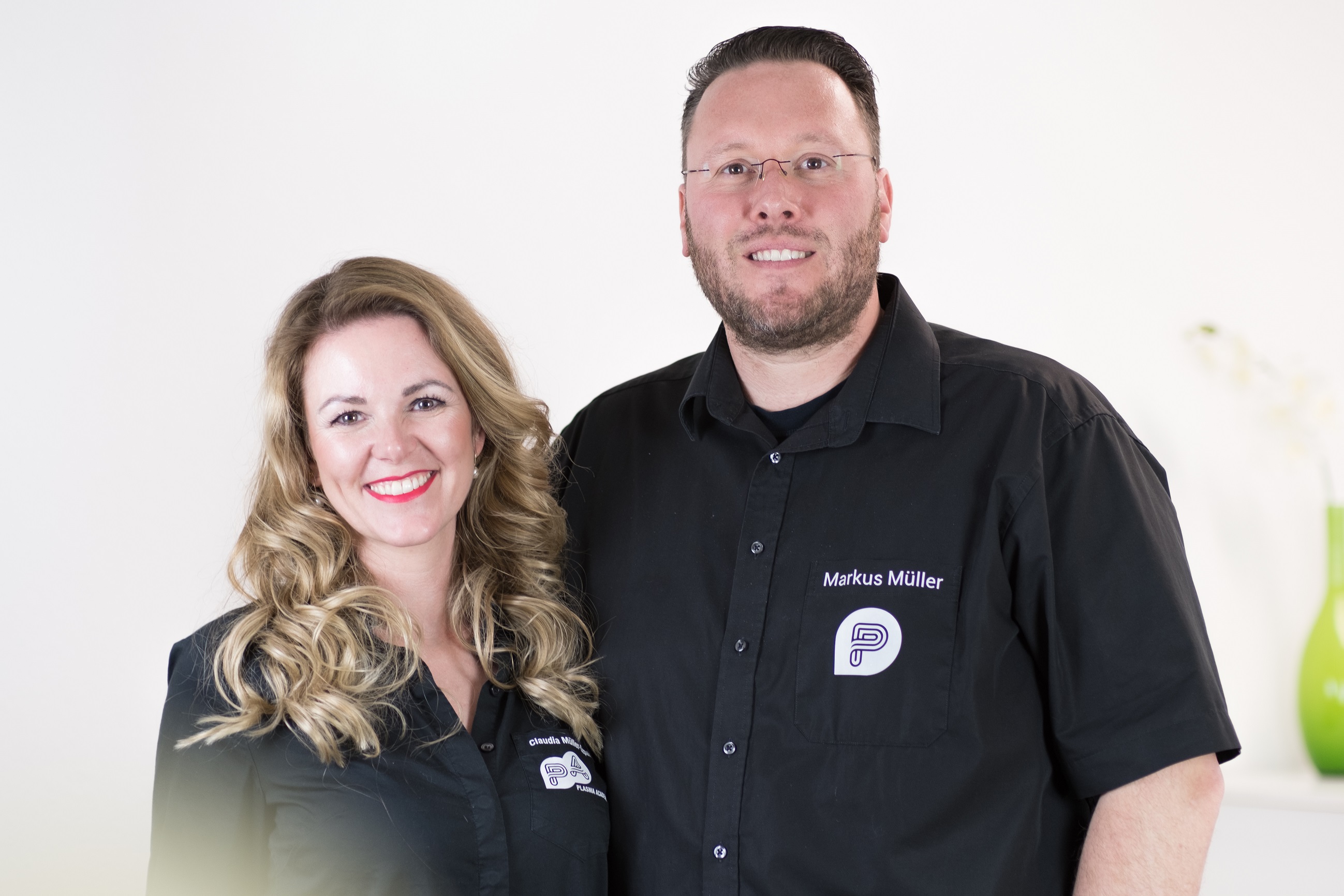 Portrait of the founding family in a production studio, showing founders and product packaging, craftsmanship and regional manufacturing authenticity.