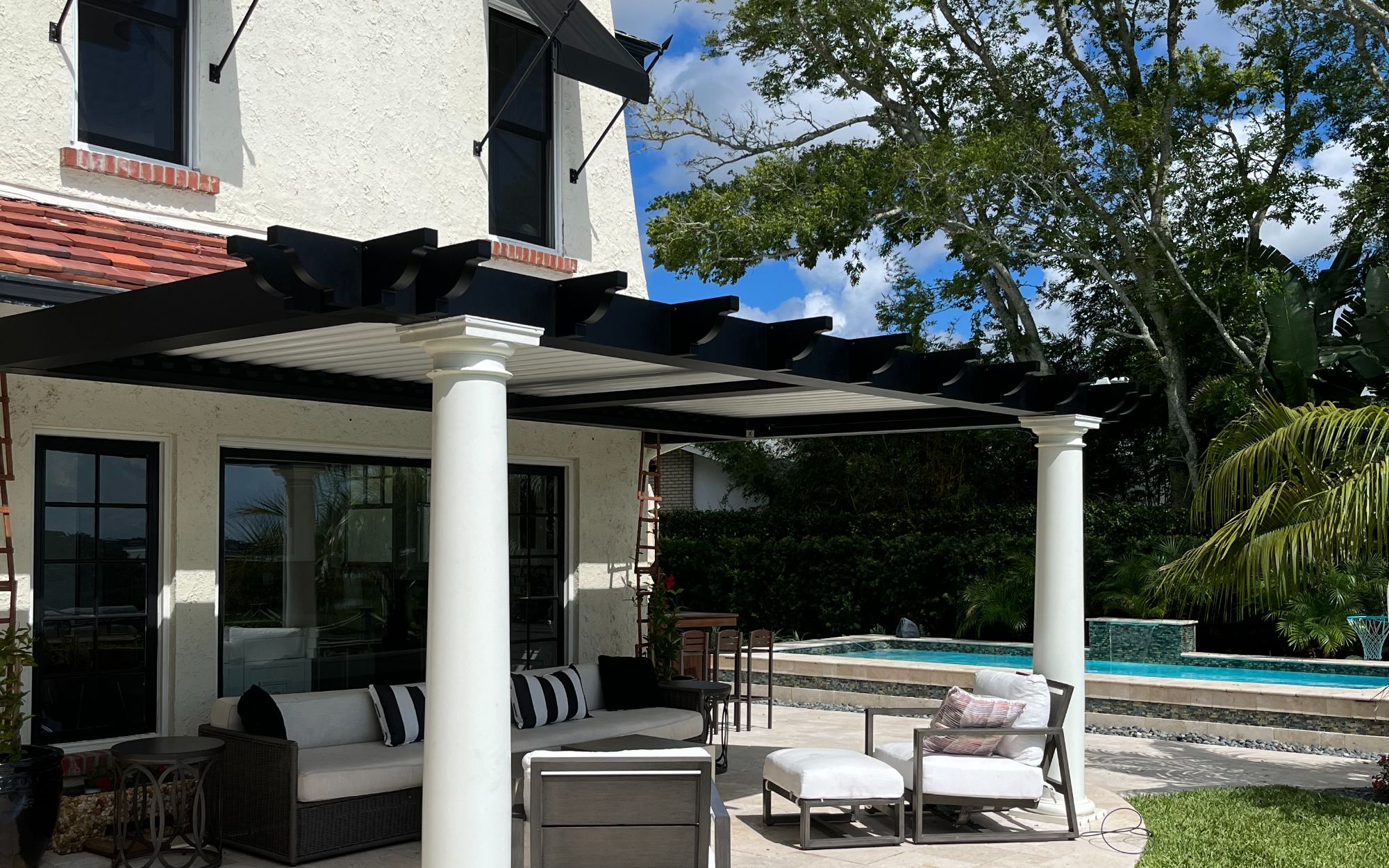 StruXure smart pergola with pool and outdoor seating area Northeast Florida Titan Outdoor Solutions