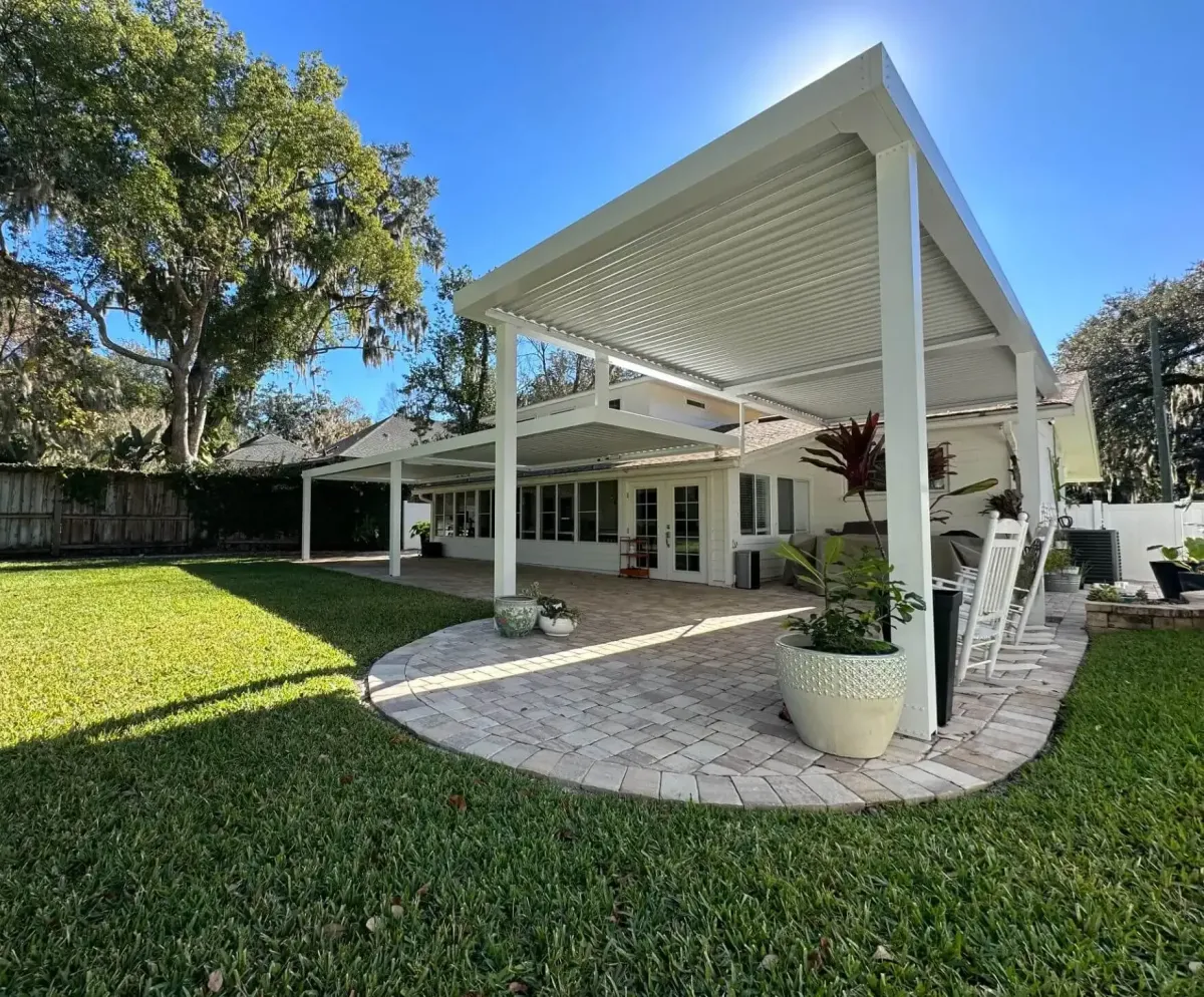 Covered outdoor patio with wood-look pergola ceiling and ceiling fan Northeast Florida