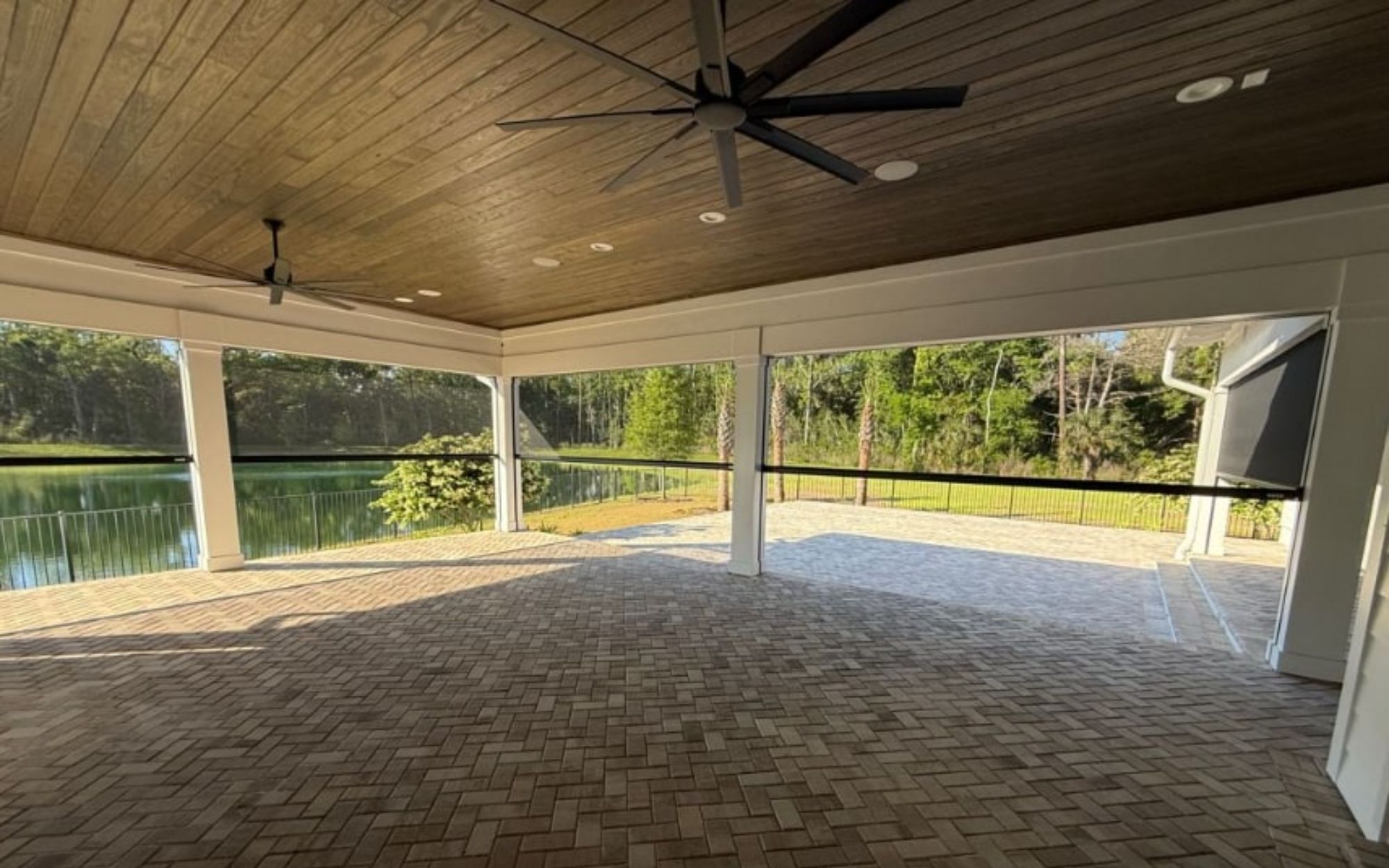 Outdoor living space at dusk with LED lit StruXure pergola blue accent lighting St. Augustine Florida