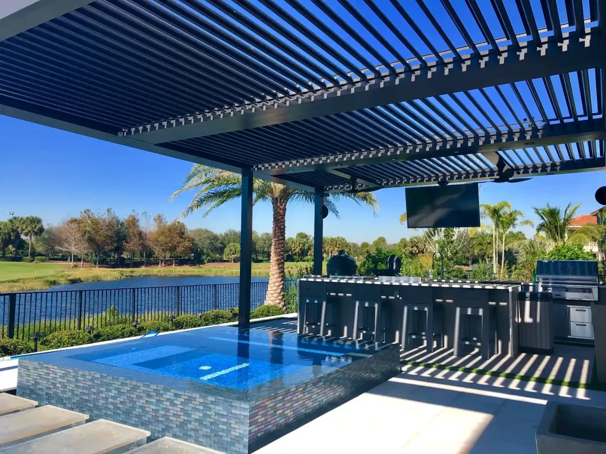 StruXure smart pergola with pool waterfront setting open louvers luxury outdoor living Florida
