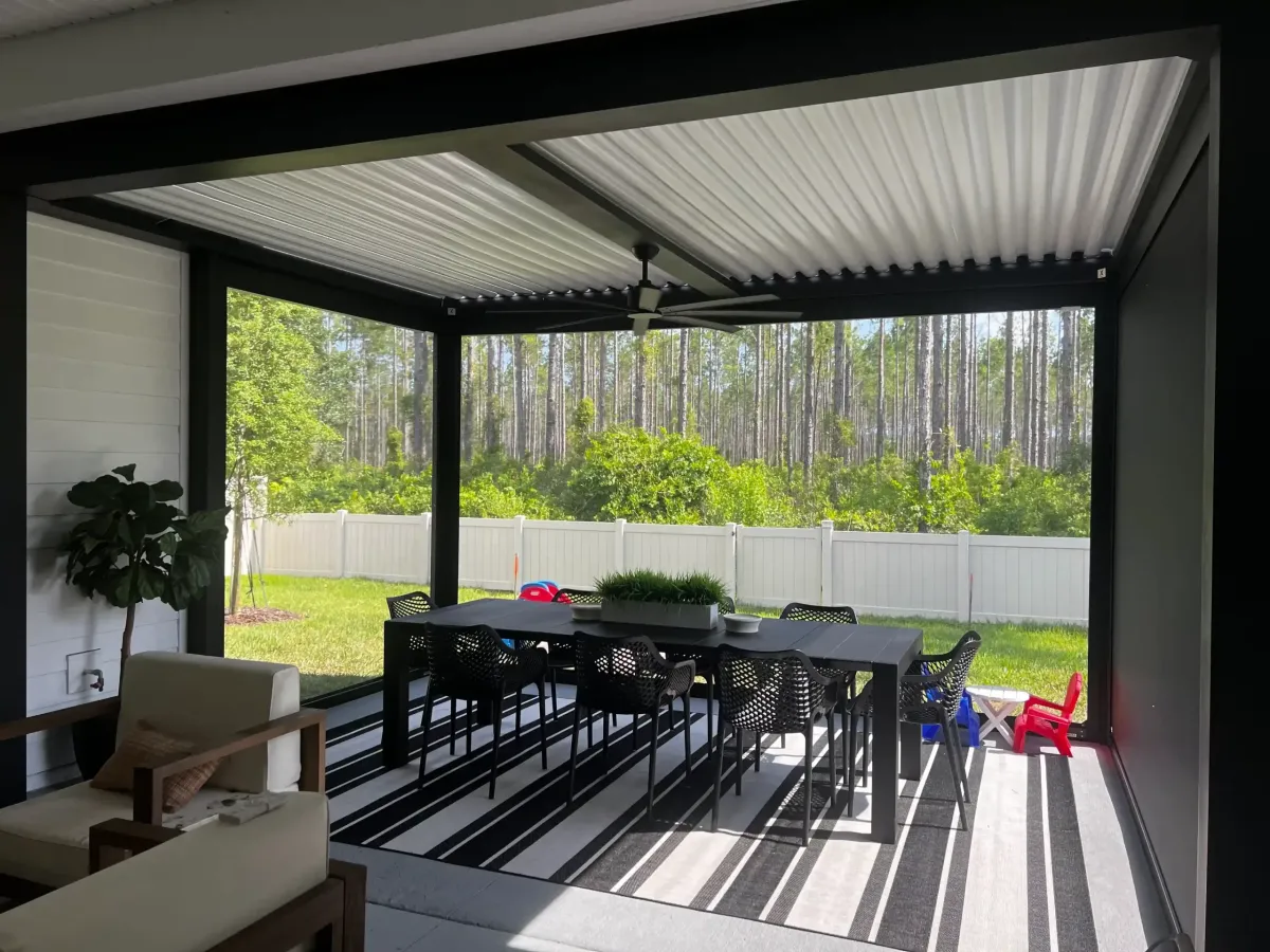 White StruXure smart pergola with closed louvers outdoor dining area Florida Titan Outdoor Solutions