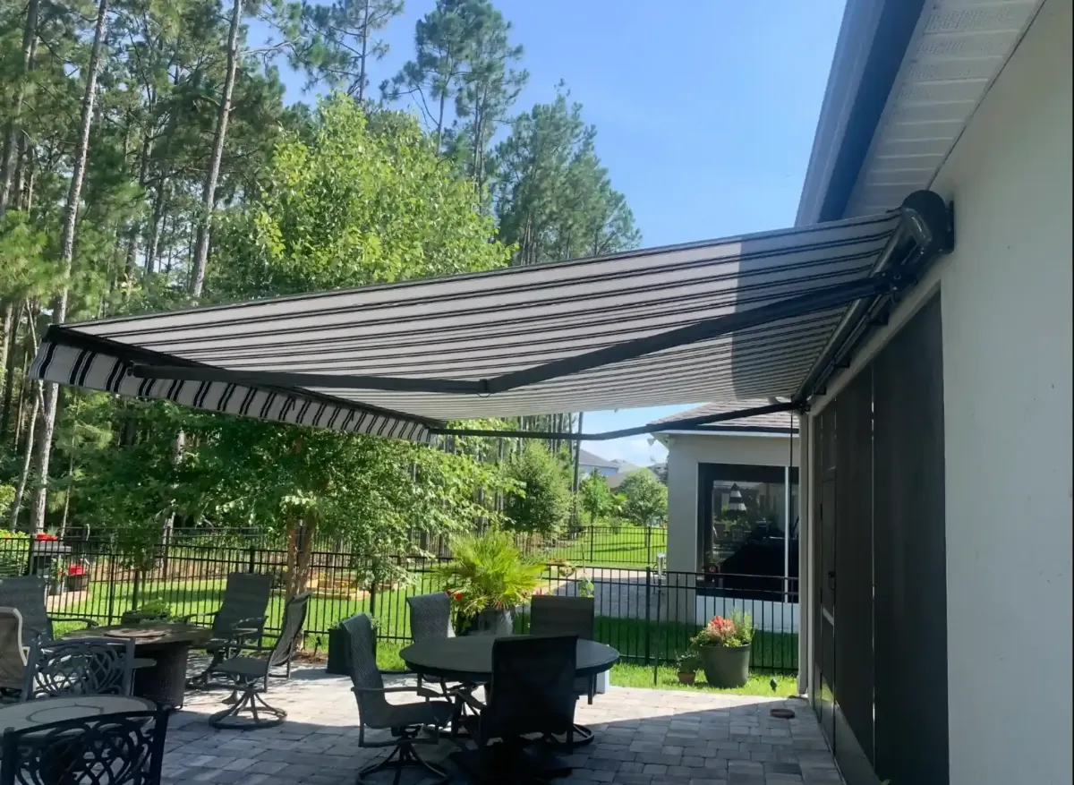 Custom pergola with adjustable louvers and outdoor seating area St. Augustine Florida