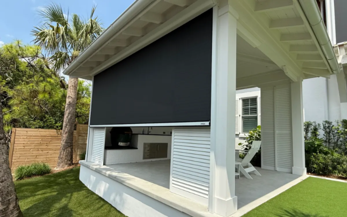 Motorized retractable hurricane screen installed on Florida home exterior St. Johns County