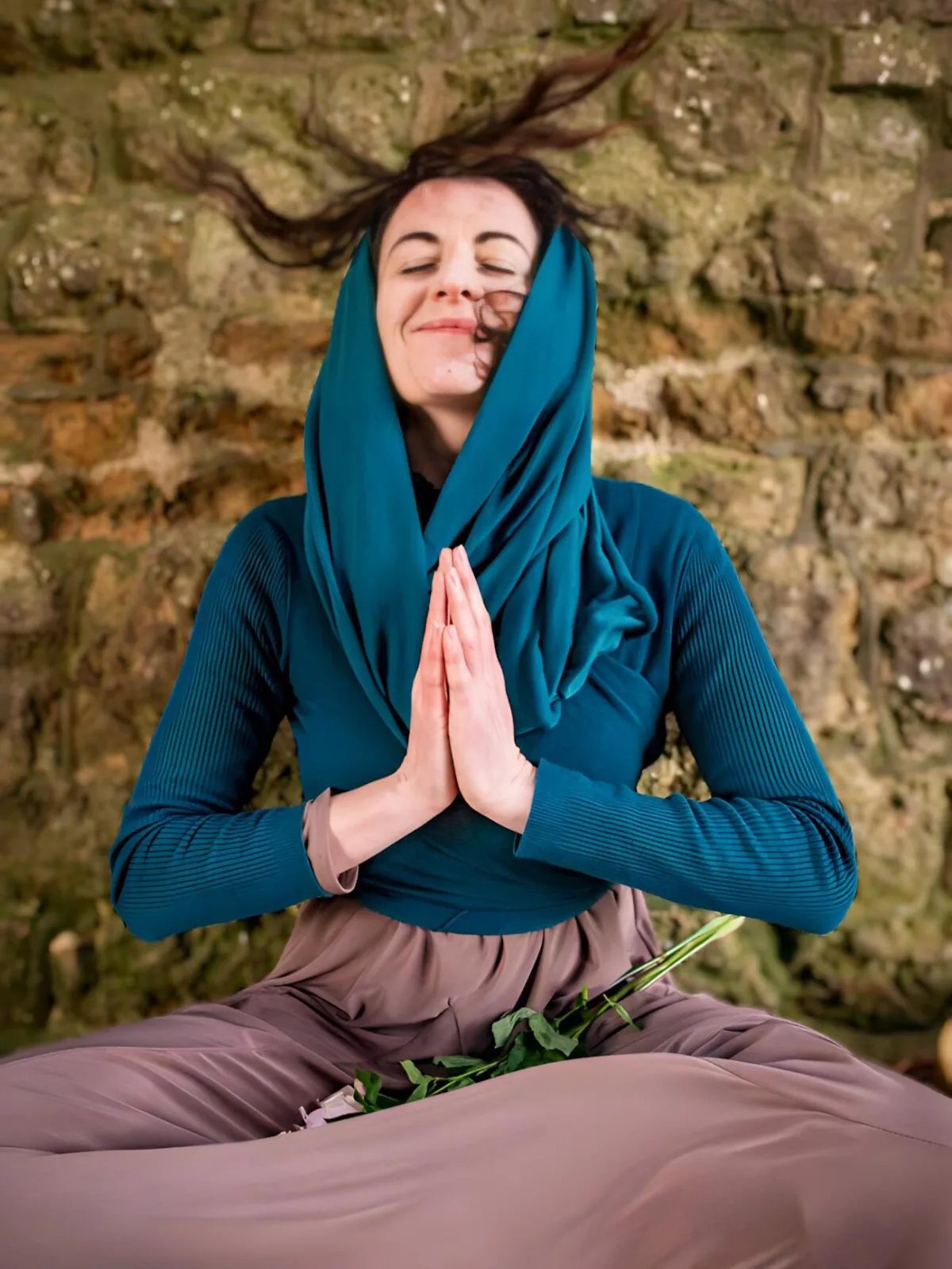 Woman engaging in sacred ritual, holding a rose in meditation, symbolizing deep feminine healing, spiritual awakening, and connection to nature.