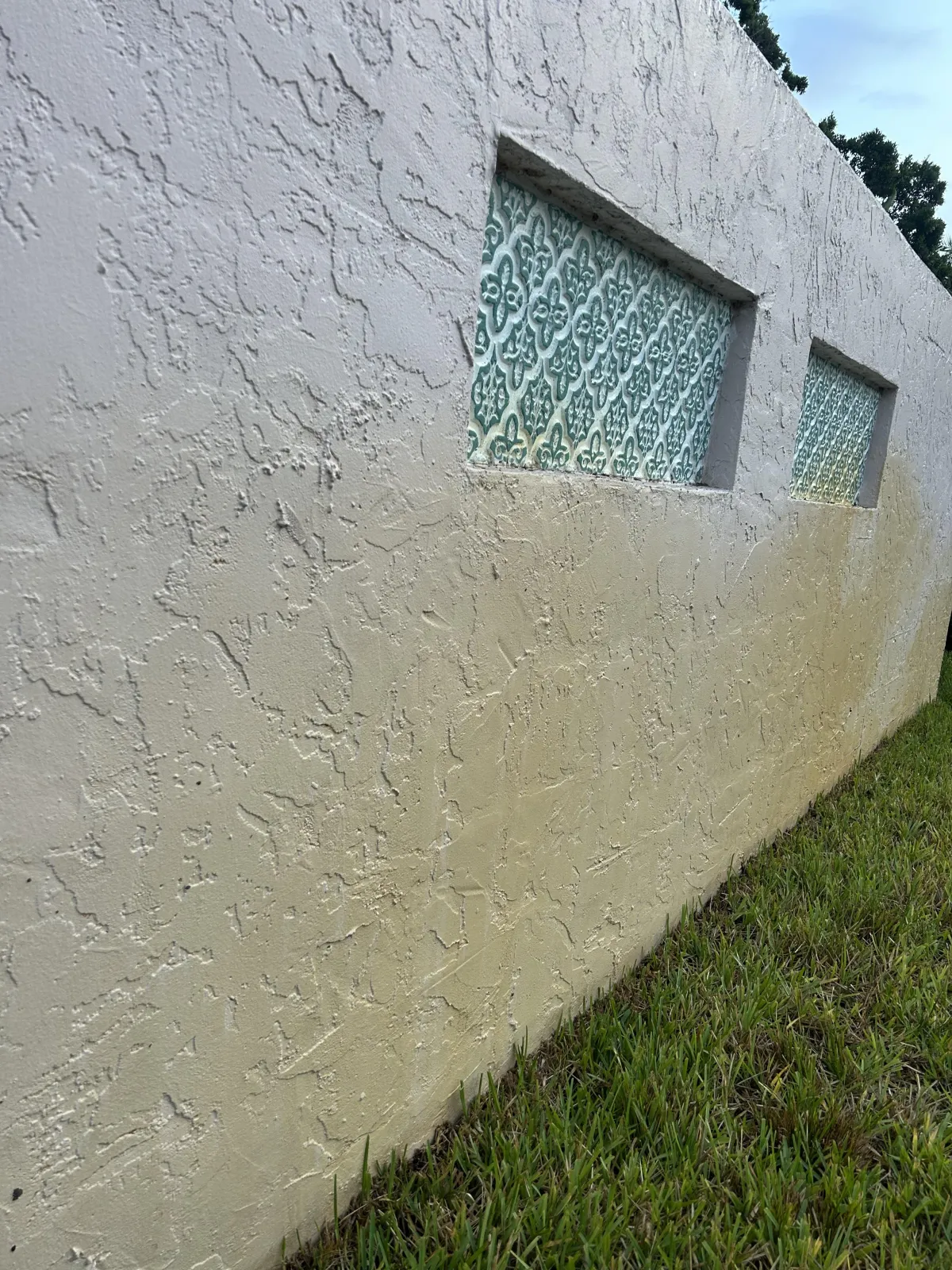 stained grey stucco on a wall 