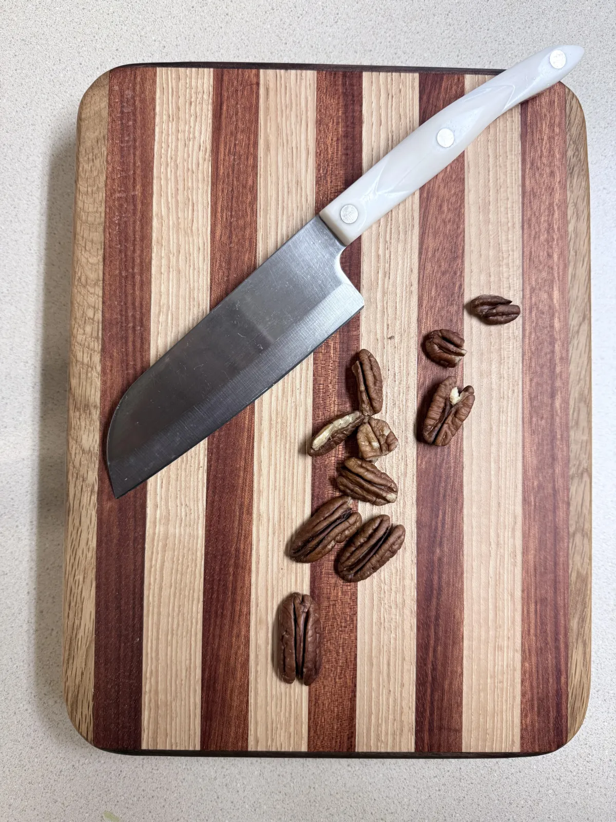 Artisan applying organic beeswax finish to a fresh butcher block