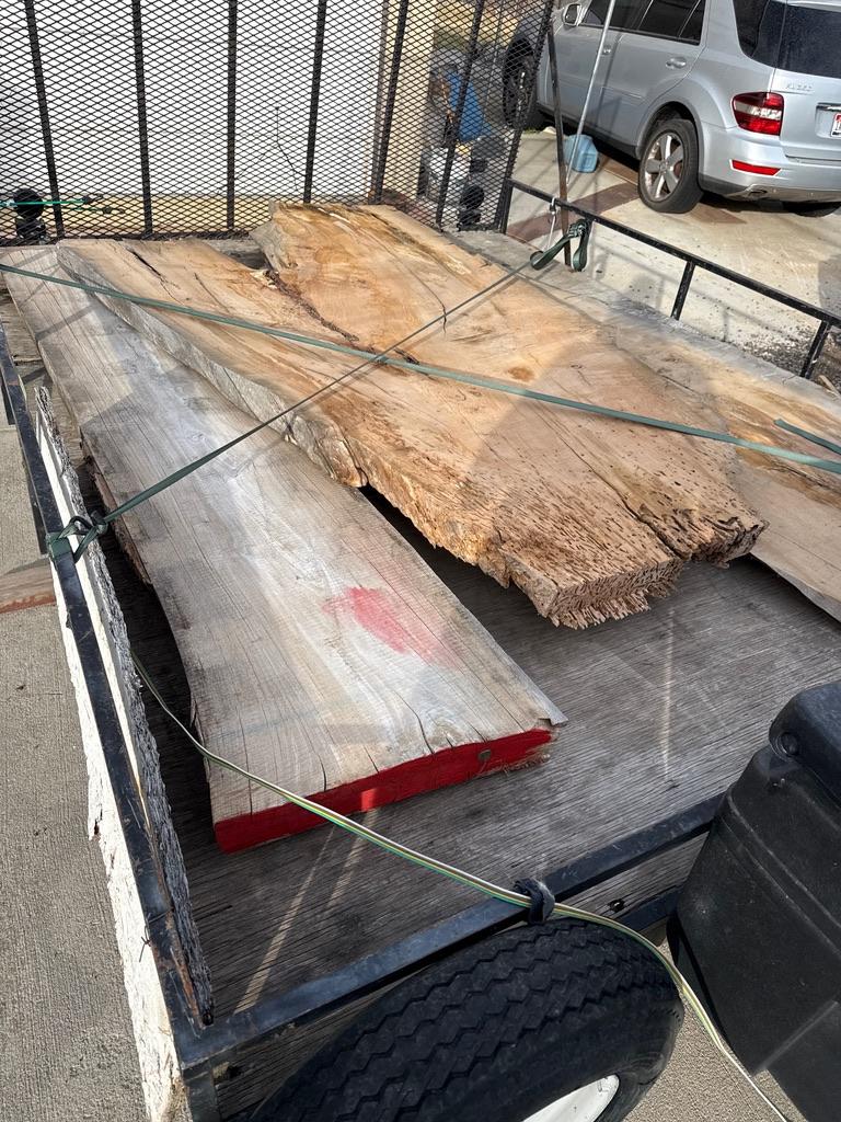 Close-up of premium raw hardwood materials showing rich grain texture