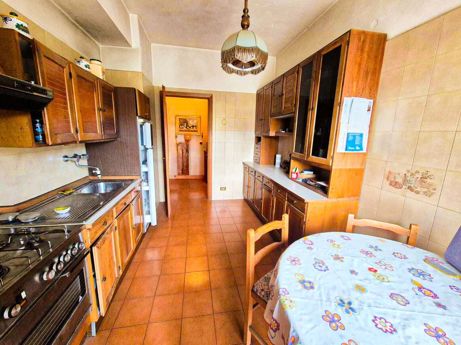 Master bedroom with king bed, textured wall panels, floor-to-ceiling drapes, and a private balcony with skyline views. 3:2 aspect ratio.