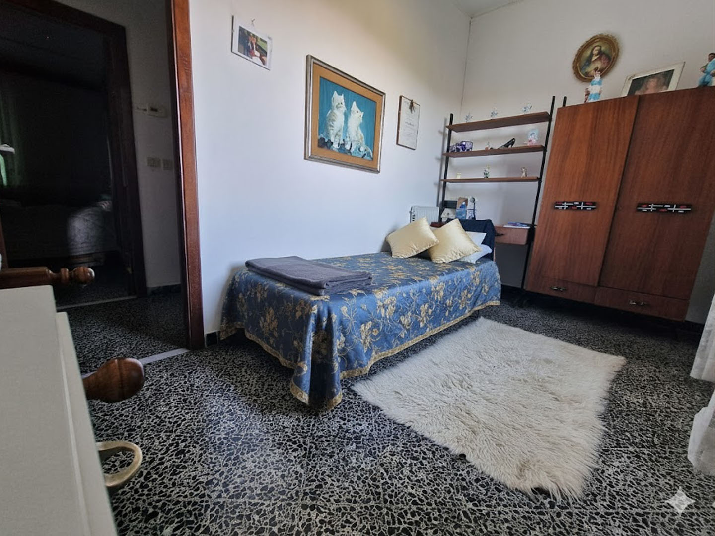 Entry foyer with marble flooring, contemporary sculpture, and indirect lighting creating a welcoming, sophisticated ambiance. 3:2 aspect ratio.