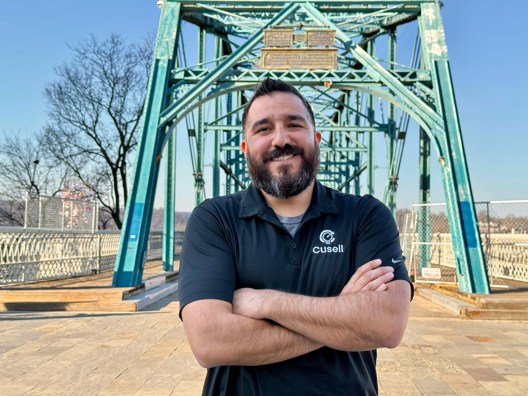 A diverse group of Chattanooga business owners gathered around a digital dashboard, reviewing analytics and competitor data in a modern office with city views, vibrant lighting, and collaborative energy. Everyone is engaged and focused on growth strategies.