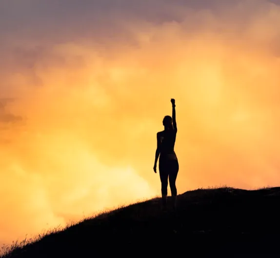 A blooming flower icon in a soft pastel square, symbolizing personal growth.