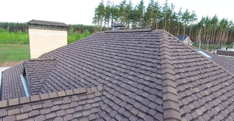 Custom backyard deck with patio furniture and umbrella for outdoor living