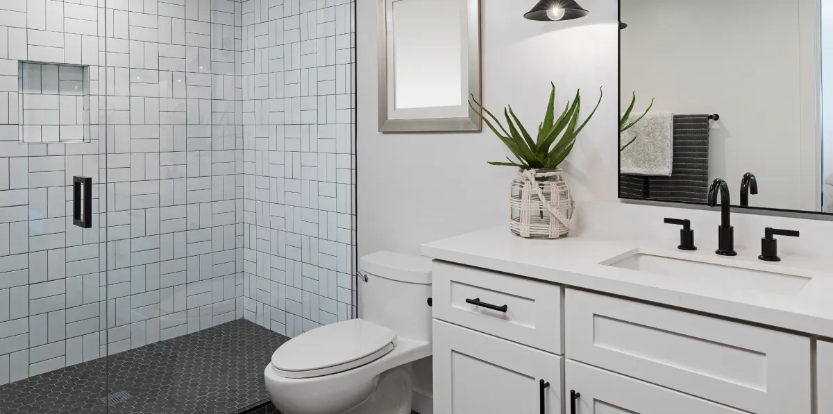 Custom kitchen renovation with new cabinetry, countertops, lighting, and open layout design