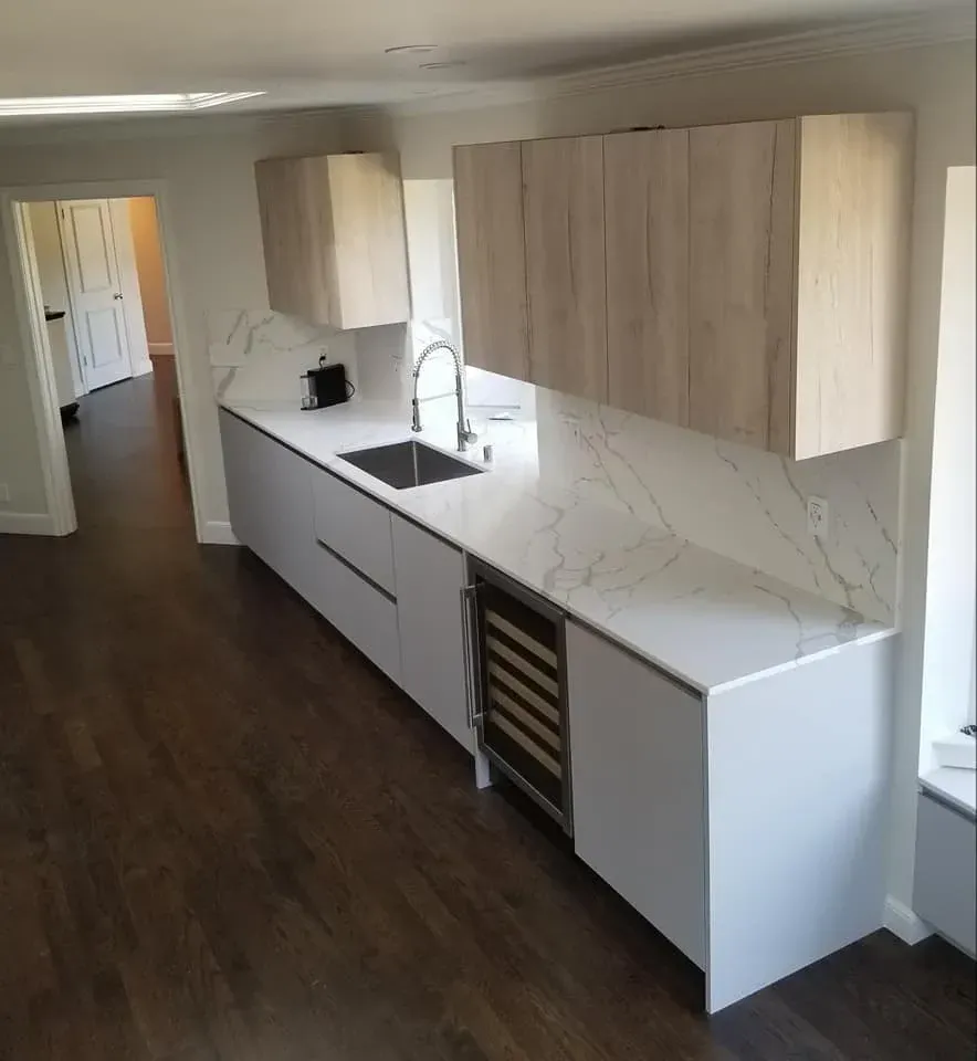 Asphalt shingle roof installation with built-in skylight on residential home