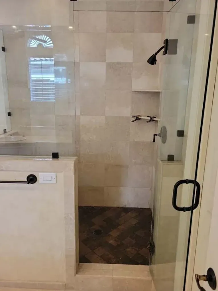 Transitional kitchen renovation with white cabinets, gray backsplash, quartz island, and natural light
