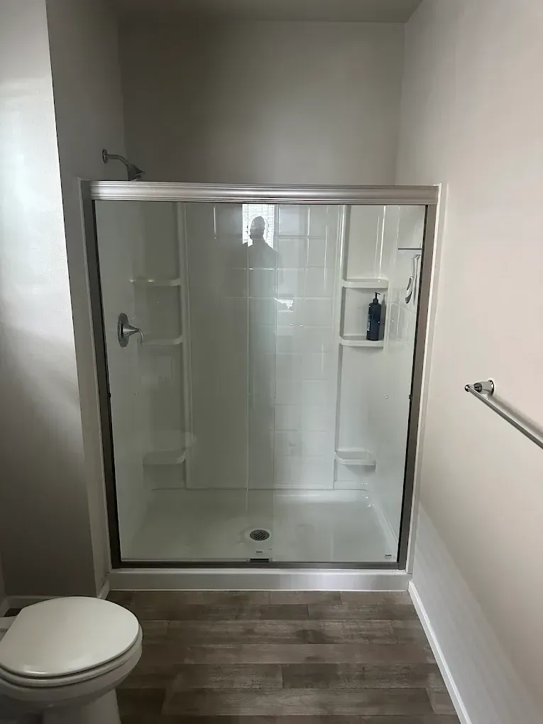 Rustic kitchen design with wood island, open shelving, modern lighting, and stainless steel appliances