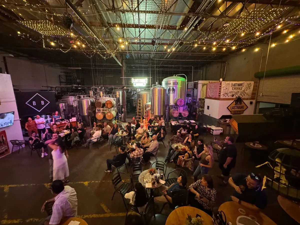 A packed taproom under string lights during an event at Mt Baldy Brewery