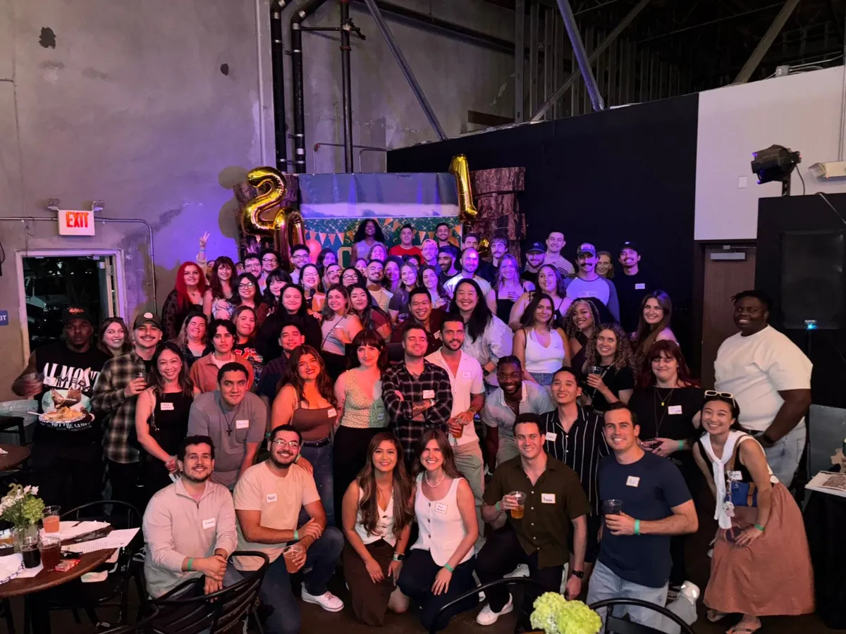 A big crowd of guests posing together in the Mt Baldy Brewery taproom