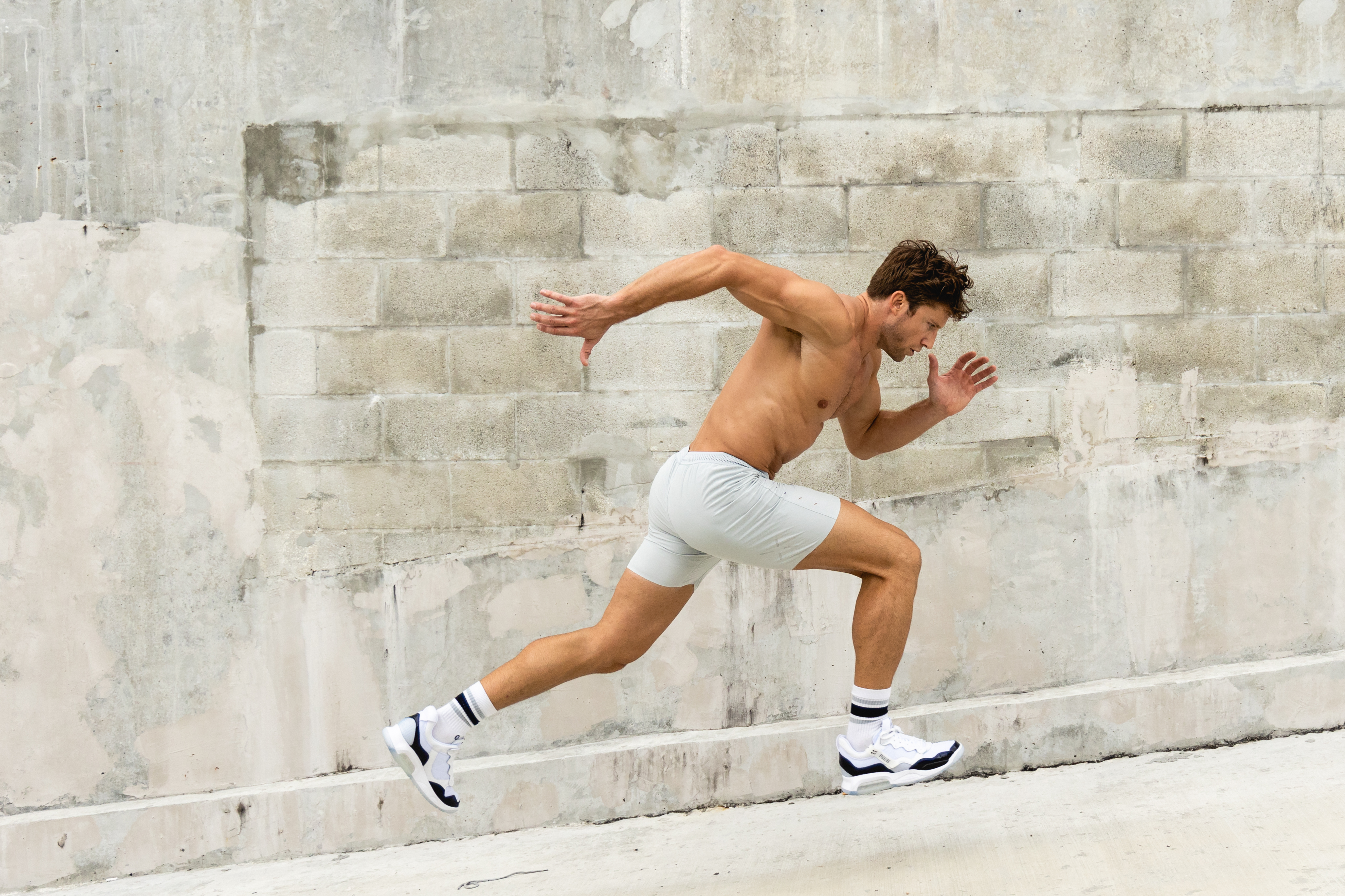 Realistic side-by-side of a leaner, stronger male physique over 16 weeks