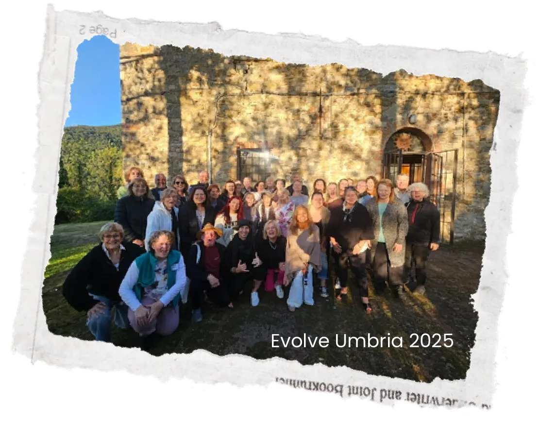 Group of people posing outdoors next to stone ruins under a blue sky, photo with torn paper edges