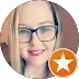 Photo of a happy customer above her 5 star review