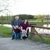 A family standing in a park, the woman in the photo recommendedLunar Luxuries on Fcebook