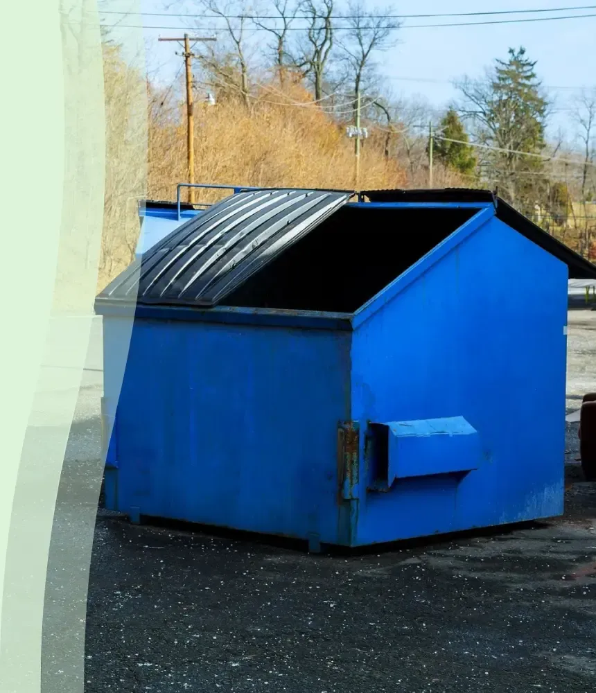 Dirty commercial blue dumpster before professional cleaning service