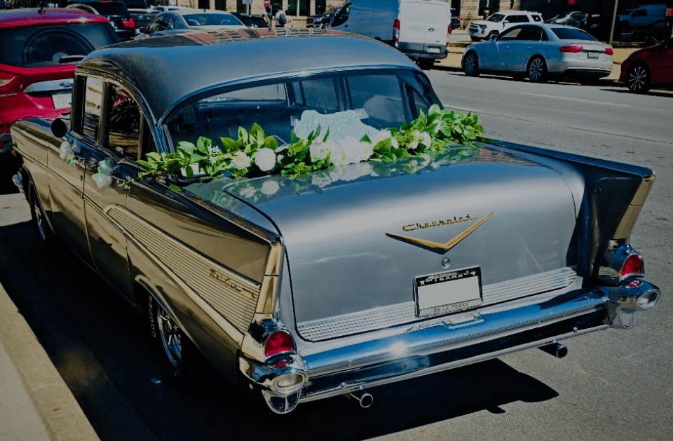 People ride on a trolley car in the city.