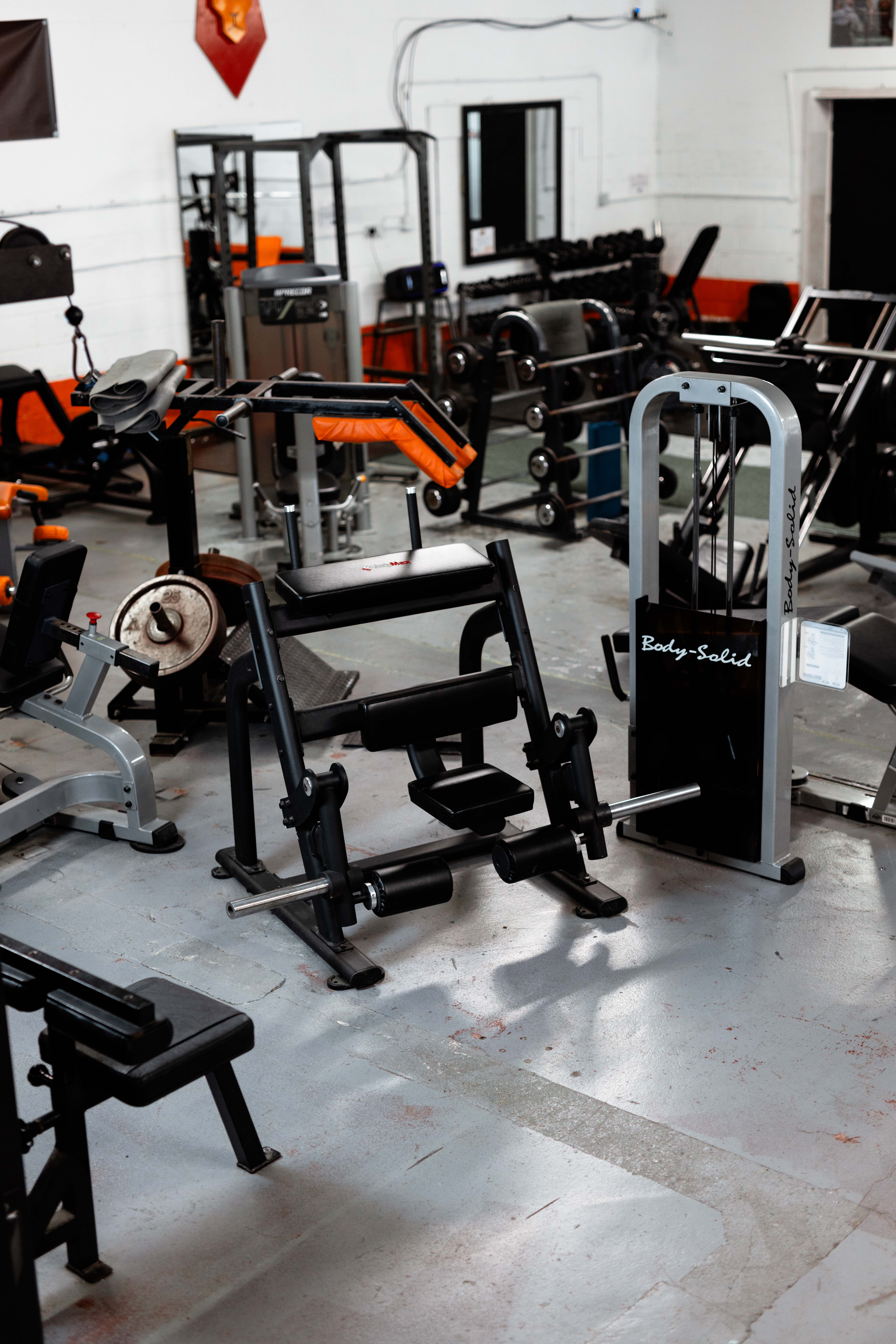 Group fitness class in progress with energetic instructor and diverse participants