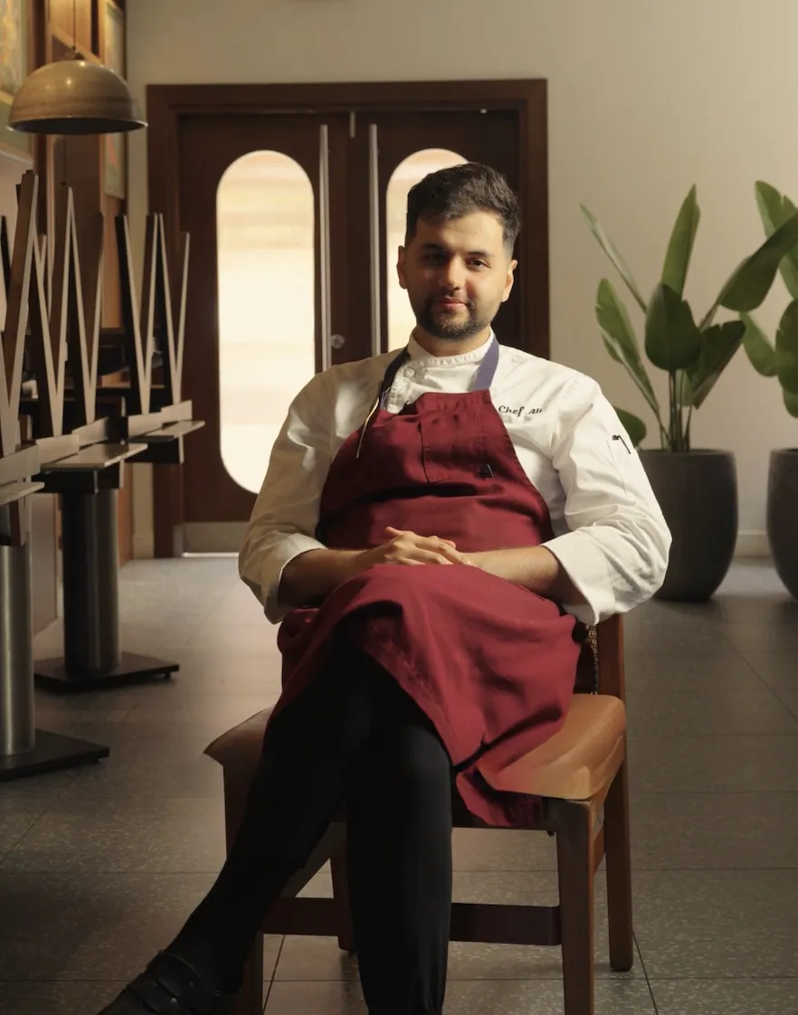 six white and brown eggs on white towel